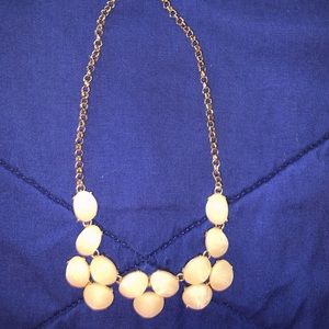 Gold and pearl colored necklace